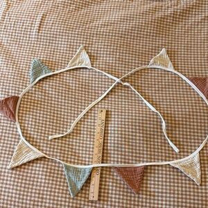 Party home decor pennant in muted colors.  8’ long.